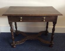 A Georgian oak single drawer side table with shape