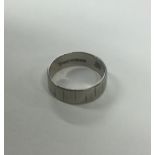 An 18 carat white gold wedding band. Approx. 4.6 g