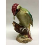 A Beswick figure of a woodpecker. Numbered 1218. E