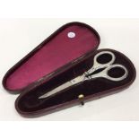 A cased pair of silver handled scissors. Birmingha