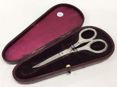 A cased pair of silver handled scissors. Birmingha