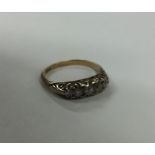 A diamond five stone half hoop ring set in 18 cara