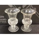 A pair of glass campana shaped vases on sweeping b