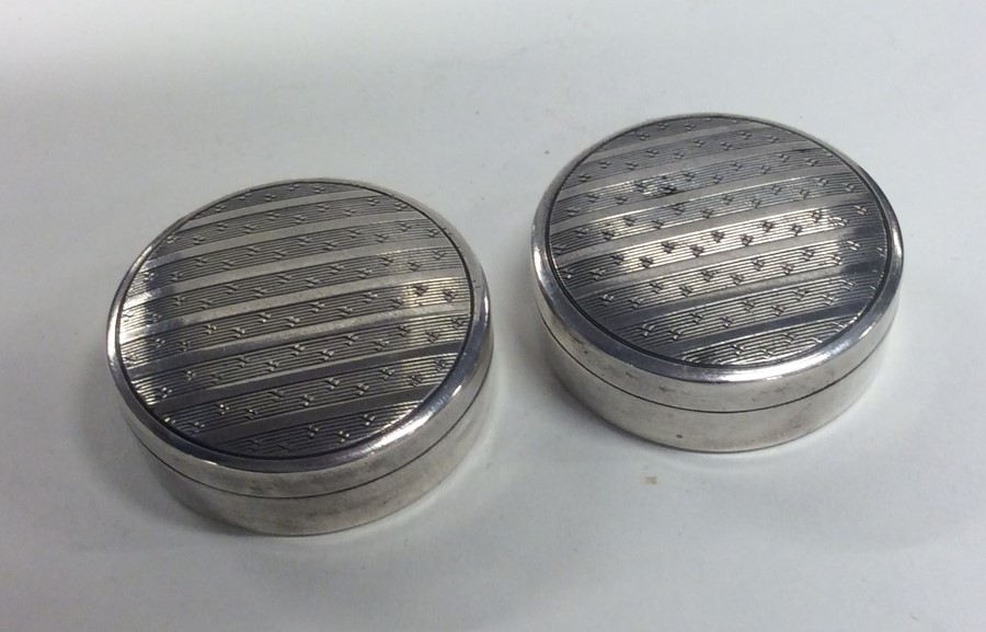 A good pair of silver pill boxes with engine turne