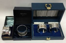 Three boxes containing silver napkin rings. Variou