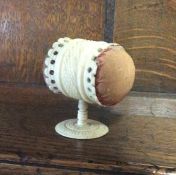 A carved ivory pin stand together with a fan. Est.