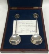 An unusual cased pair of limited edition silver pr