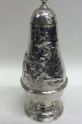 An unusual Victorian embossed silver sugar caster