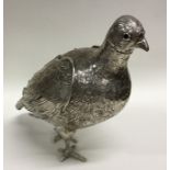 A large silver figure of a grouse with detachable