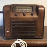 A Rogers veneered radio. Est. £20 - £30.