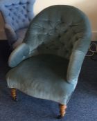 A Victorian button back armchair. Est. £20 - £30.