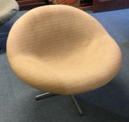 A small upholstered swivel chair on chrome base. E