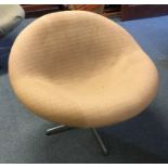 A small upholstered swivel chair on chrome base. E