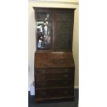 A good Georgian style mahogany bureau-bookcase wit