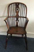 An Antique stick back Windsor chair of typical for