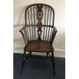 An Antique stick back Windsor chair of typical for