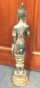 An Eastern figure of a lady on sweeping pedestal b