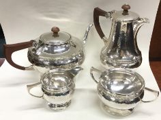 A E JONES: A fine quality silver four piece tea se