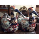 A pair of massive Imari decorated duck tureens wit