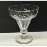 A large Georgian tapering fluted glass drinking ve