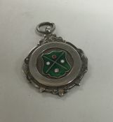 A silver and enamelled circular fob. Approx. 12 gr