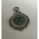 A silver and enamelled circular fob. Approx. 12 gr