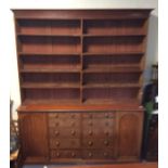 A tall mahogany bookcase with moulded frieze. Est.