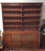 A tall mahogany bookcase with moulded frieze. Est.