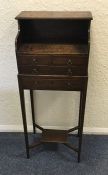 An Antique oak miniature five drawer chest on tape