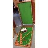 A good mahogany cased billiards game. Est. £30 - £