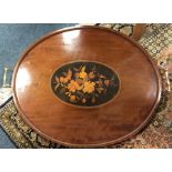 An oval inlaid tea tray. Est. £40 - £60.