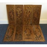 An unusual set of eight mahogany inlaid plaques de