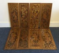 An unusual set of eight mahogany inlaid plaques de