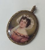 An attractive oval gold framed miniature of a girl