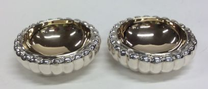 A pair of good quality silver and silver gilt salt