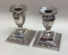 A pair of small tapering silver candlesticks. Lond