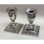 A pair of small tapering silver candlesticks. Lond