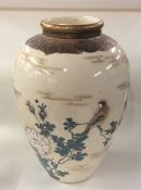 A Japanese Satsuma vase decorated with flowers and