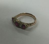 A good ruby and diamond five stone half hoop ring.
