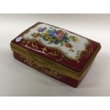 LIMOGES: A decorative hinged top box with brass mo