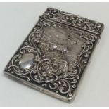 An Edwardian silver hinged top card case depicting