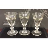 A set of three heavy Georgian glass spirit tots on