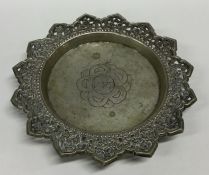 A Continental silver coaster with shaped edge. App