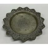 A Continental silver coaster with shaped edge. App