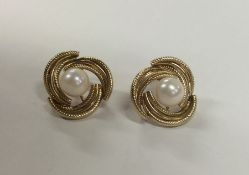 A pair of 9 carat pearl twist earrings. Approx. 4.