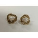 A pair of 9 carat pearl twist earrings. Approx. 4.
