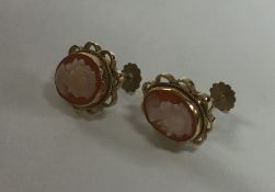 A pair of 9 carat mounted cameo earrings. Approx.