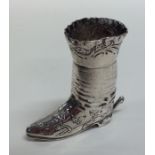 A tall Dutch model of a boot decorated with flower