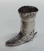 A tall Dutch model of a boot decorated with flower