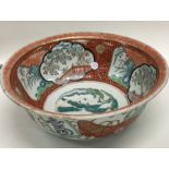 A decorative Chines bowl decorated in bright colou
